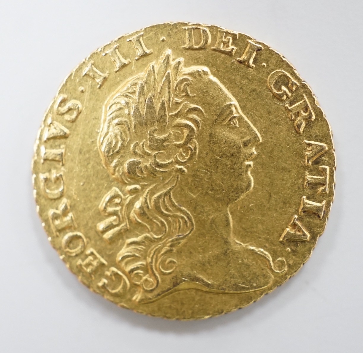A George 1762 third of a guinea, good VF, 2.1 grams.